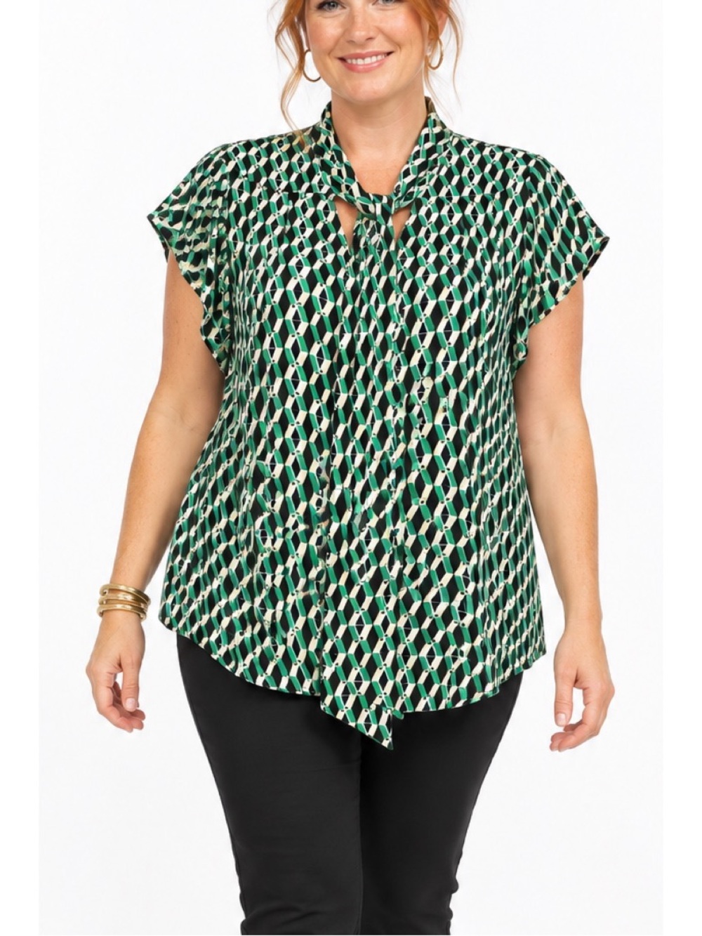 Pleione Blouse in a bold green, black, and white geometric diamond pattern